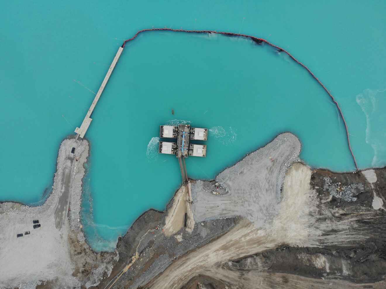 Barrier and walkways Xrosswater mining tailings pond in Canada