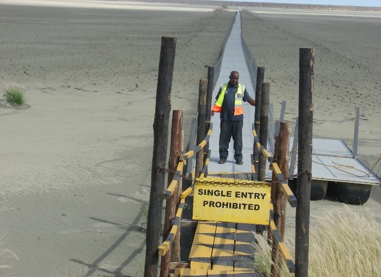 Walkways and pump platforms in mining tailings pond in Botswana Africa